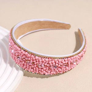 Detail of pink beaded headband with marquise crystals and colorful rhinestones edge