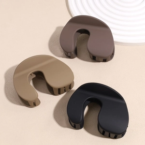 Minimalist matte shark hair clips in dark brown, khaki, and black for elegant hairstyling