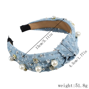Detailed shot of light blue denim headband featuring hand-sewn pearls and sequins decor