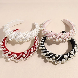 Baroque pearl sponge headbands in white, pink, red, and black with a wide-brimmed design