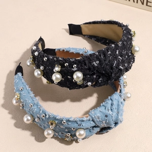 Elegant twisted headbands with white pearls and rhinestones on denim and tweed fabric