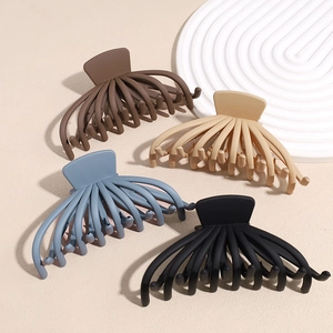 Matte octopus hair claws in brown, beige, blue, and black for thick hair styling