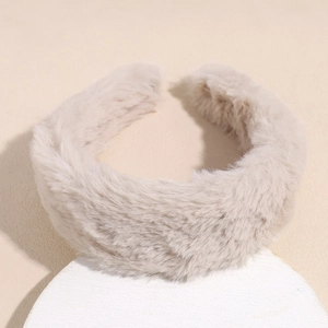 Close-up of beige plush headband showing thick soft faux fur texture on a round base