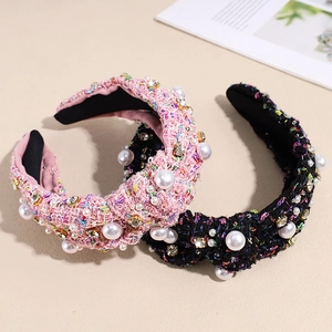 Elegant tweed knot headband with pearls and rhinestones in pink and black colors