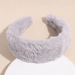 Close-up of thick plush faux rabbit fur headband in elegant light grey color