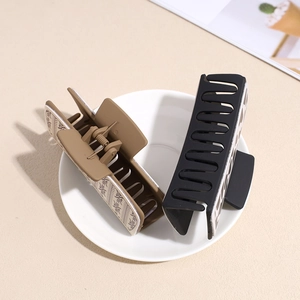 Retro PU leather large hair claw clips in matte black and coffee with geometric pattern