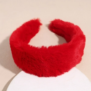 Close-up of thick plush red headband on stone base showing soft faux fur texture