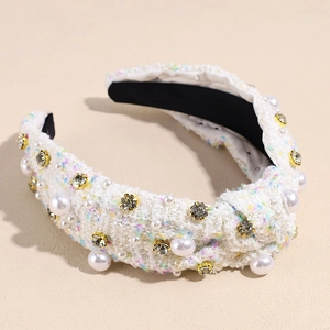Detailed macro of tweed headband featuring white pearls and sparkling grey rhinestones