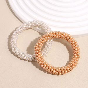 Elegant pearl bead elastic hair ties in white and champagne orange for stylish ponytails