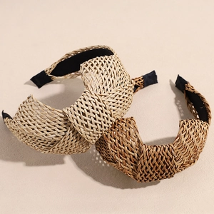 Bohemian style raffia woven headbands in light beige and dark brown with top knot design