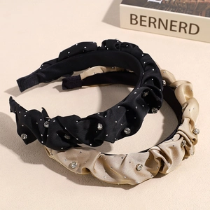 Cerchietto plissettato in raso con strass eleganti in nero e colore champagne
