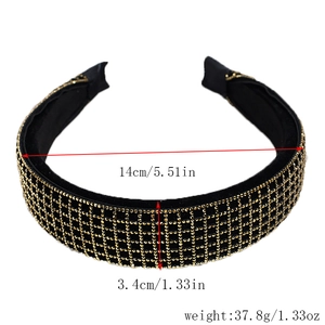 Detailed view of black headband with golden rhinestones and size measurements