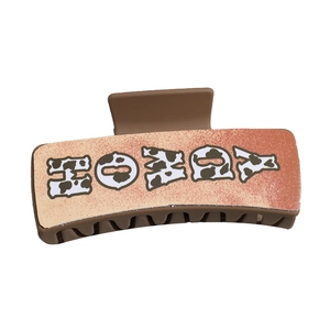 Retro rectangle PU leather hair claw clip featuring HOWDY text with cow print pattern