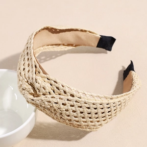 Close-up of bohemian woven straw headband with knot design and soft non-slip lining