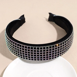 Detail of velvet padded headband with sparkling iridescent rhinestones in grid pattern