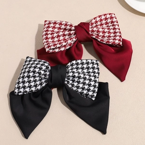Elegant bow hair clips featuring black and red houndstooth and satin fabric layers