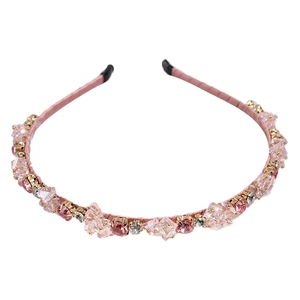 Serre-tête élégant aux cristaux roses et griffes dorées sur base en tissu doux