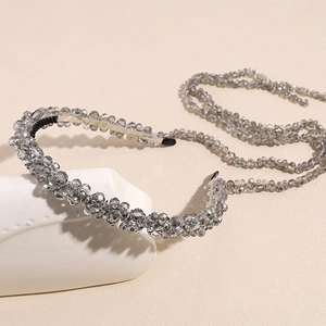 Detail of luxury crystal headband with grey faceted beads and long hanging tassels