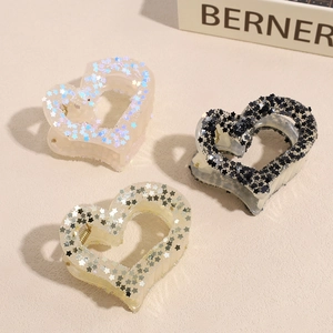Star glitter heart-shaped hair claw clips in pink, champagne, and black colors