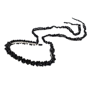 Black crystal beaded headband with luxury long tassels on a clean white background