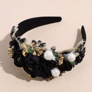 Detail of baroque headband featuring black silk roses, gold leaves, and white pearls