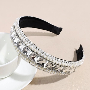 Detail shot of baroque style headband with large square crystals and white pearls