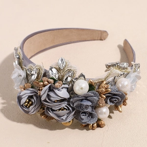 Detailed close-up of Baroque headband with pearls, fabric roses and crystals