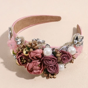 Detail of pink baroque headband with fabric roses, faux pearls and crystals