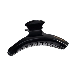Classic black acetate hair claw clip with golden handmade to France logo on white background