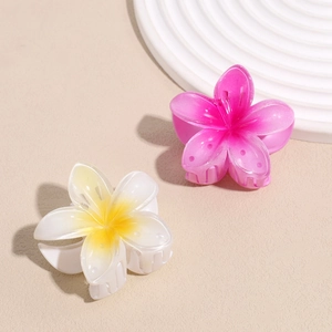 Colorful gradient plumeria flower hair claws set in pink and yellow for beach styling