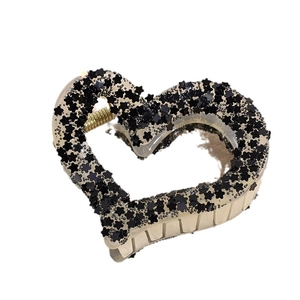 Star and heart shaped resin hair claw clip with black sequins and golden metal spring