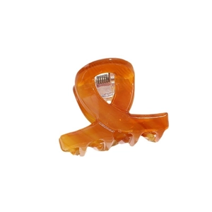 Polished amber acetate hair claw clip with marble texture and metal spring for women