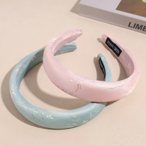 Elegant set of two jacquard silk padded headbands in pastel pink and blue colors