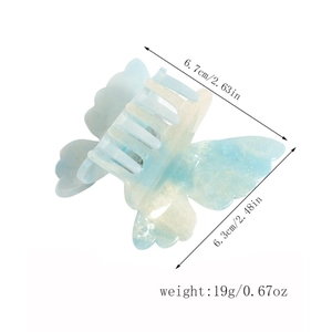 Detailed view of light blue butterfly hair claw clip with dimensions 6.7cm by 6.3cm