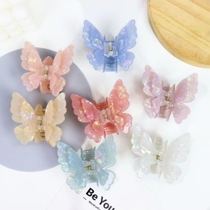 Set of 7 colorful iridescent butterfly hair claws with elegant 3D double wings for styling