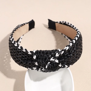 Detail of black and white woven raffia headband with twisted knot and inner lining