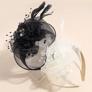 Elegant vintage bridal fascinator with mesh veil feathers and pearls in black and white