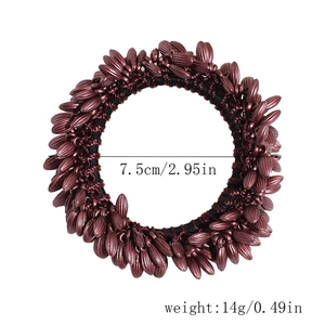 Macro detail of wine red wheat grain elastic hair tie with 7.5cm diameter measurement
