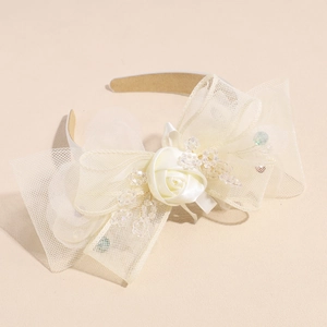 Detail of elegant mesh bow headband with satin rose and crystal bead embellishments