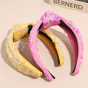 Cerchietti annodati con paillettes rosa e gialle con finitura glitterata cangiante