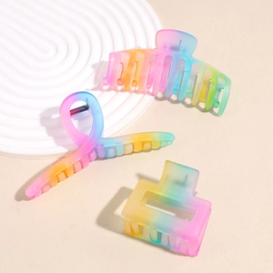 Three-piece matte rainbow gradient hair claw clip set with pastel ombre geometric designs