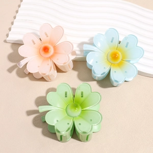 Lot de trois pinces à cheveux fleurs de frangipanier en résine rose, bleu et vert