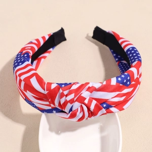 Close-up of patriotic American flag headband with star patterns on a white ceramic bowl