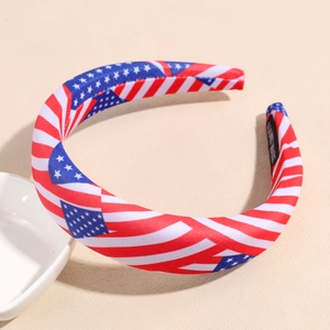Detail of USA flag themed wide headband featuring handmade black label and fabric texture