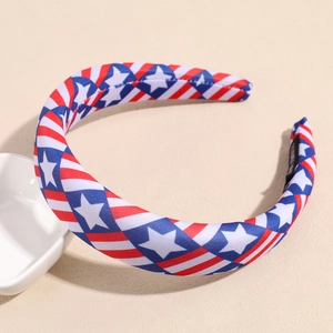 Close-up of wide American flag headband featuring red white stripes and blue starry fabric