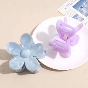Large floral hair claw clips with marble texture for elegant updo hairstyles