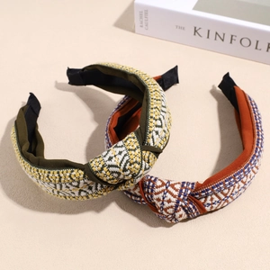 Two woven knotted headbands in retro fabric patterns for a stylish vintage hair accessory