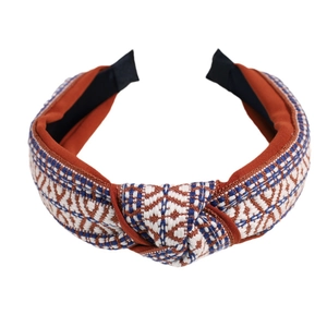 Retro woven headband with geometric pattern and top knot in red and navy blue