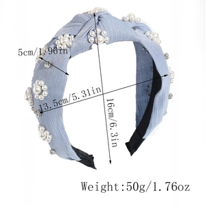 Detail view of light blue knotted pearl headband with size dimensions and weight info