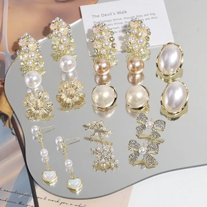 Elegante juego de pendientes de plata 925 dorada con perlas, lazos y borlas largas